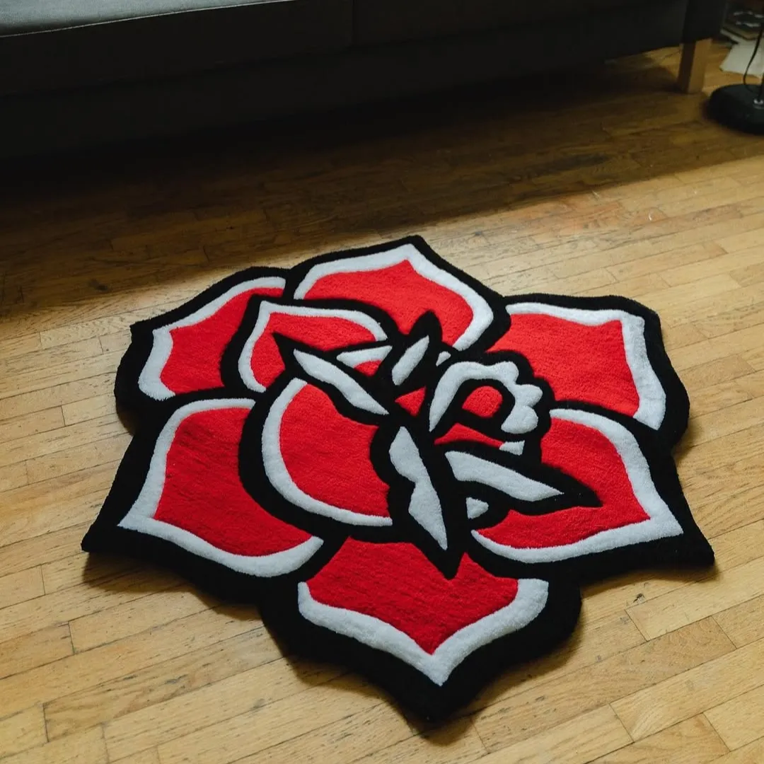 Red rose-shaped custom area rug on wooden floor