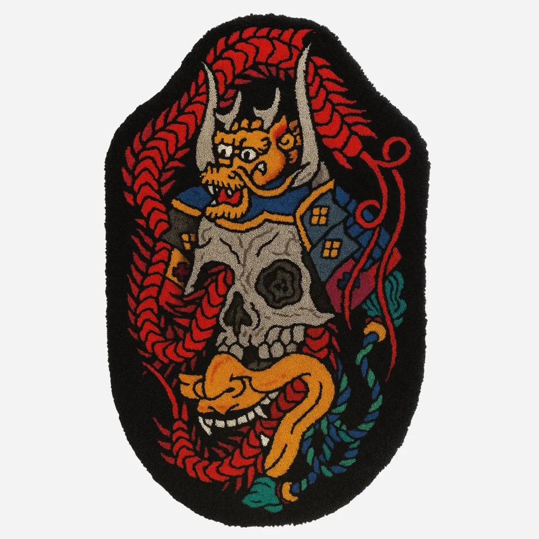 Hand tufted rug featuring a Japanese samurai skull with helmet, red rope, and colorful tattoo-style elements on a black background.