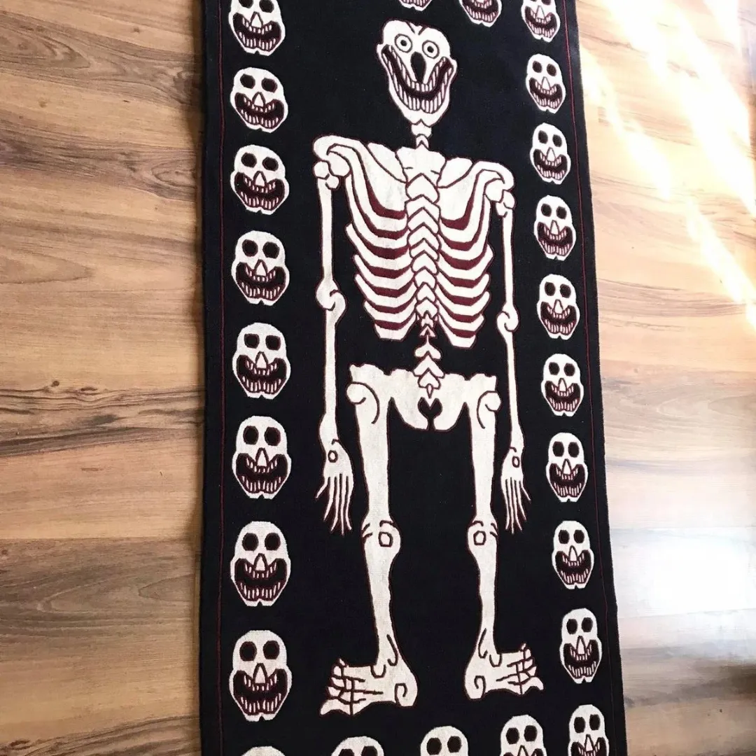 Hand-tufted detail of bone-white skeleton rug design