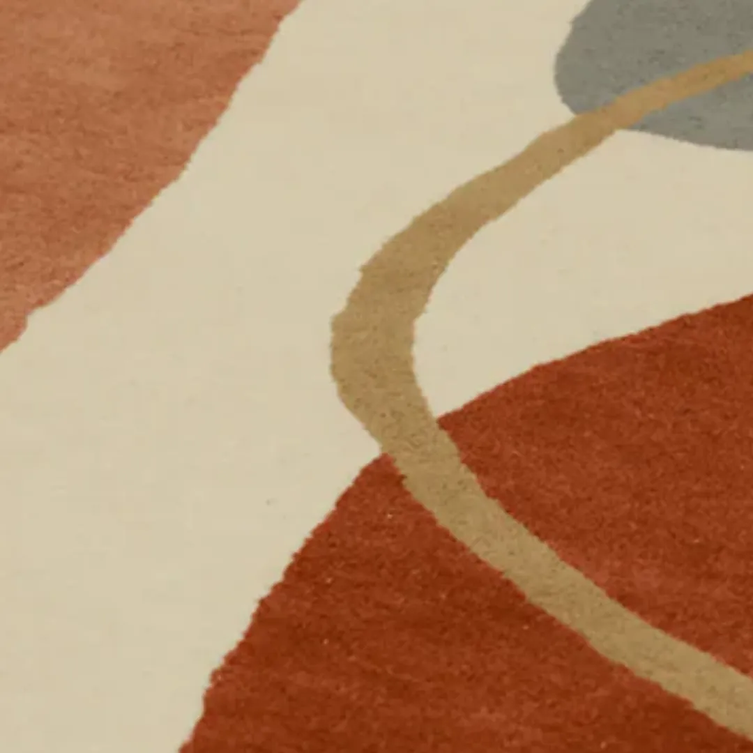 Abstract Flow round rug with smooth curves and geometric shapes in neutral tones.