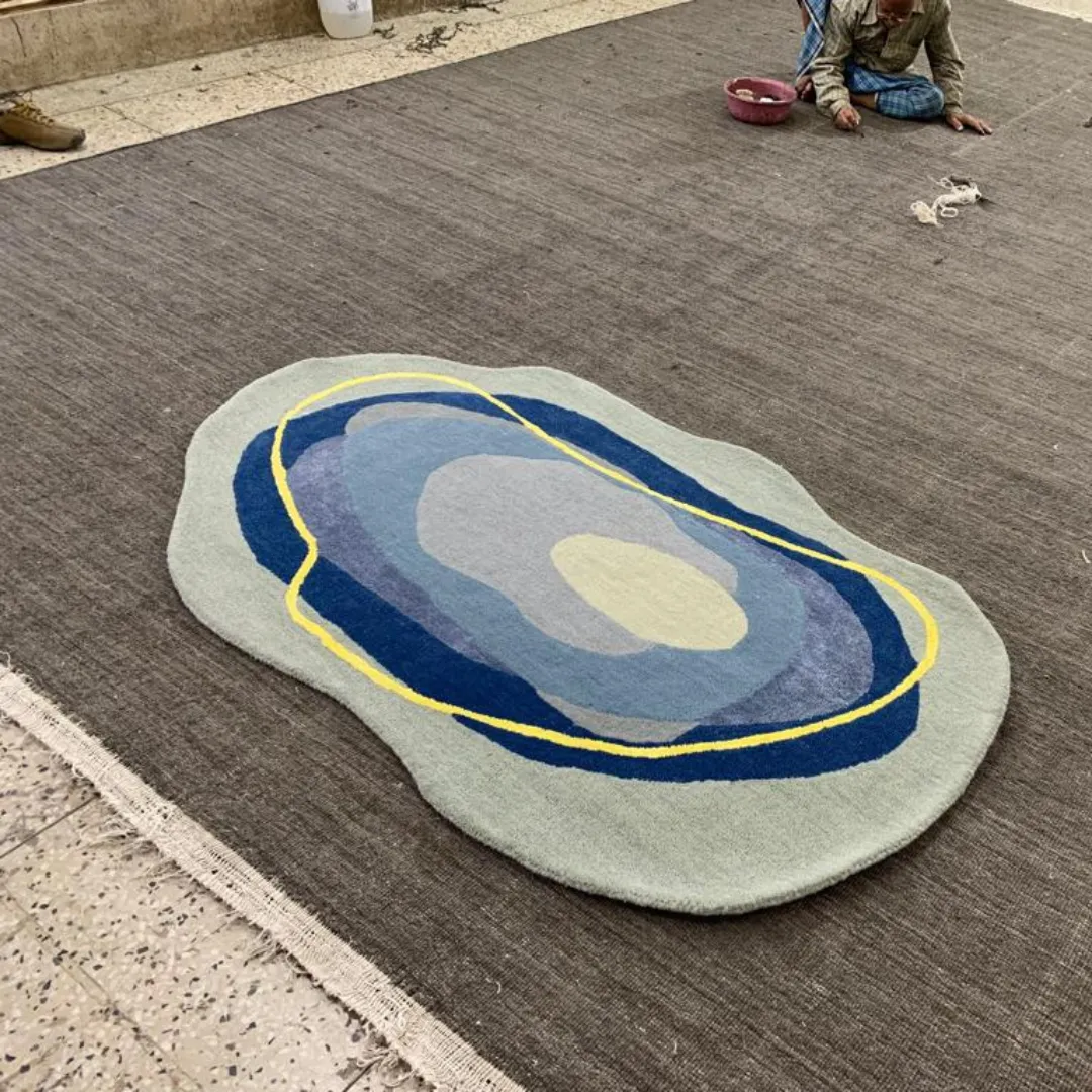 Modern area rug featuring overlapping organic shapes in vibrant colors.