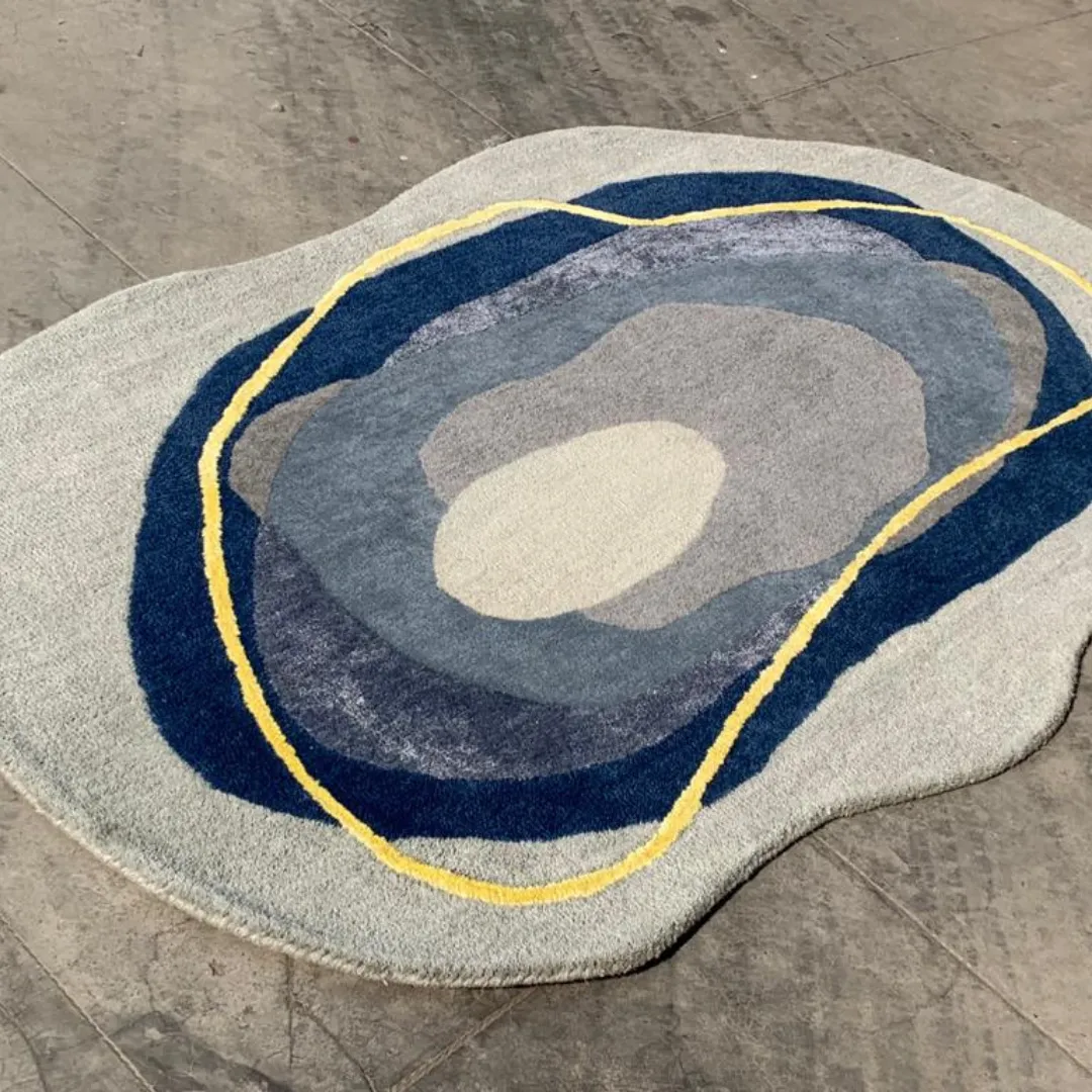 Auralis rug with smooth flowing organic design in shades of blue and yellow.