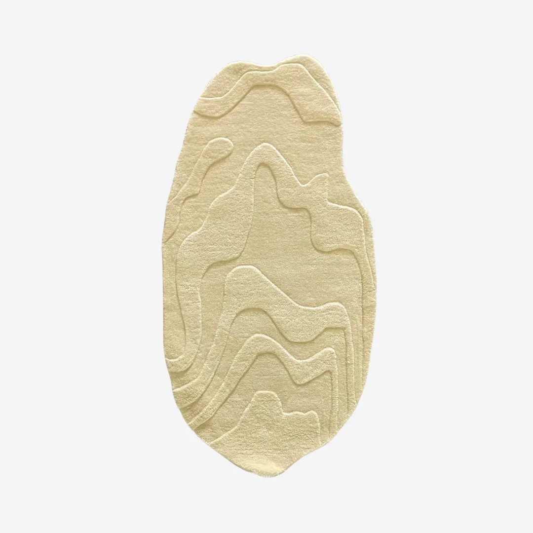 Organic shaped rug with flowing, textured design in beige.