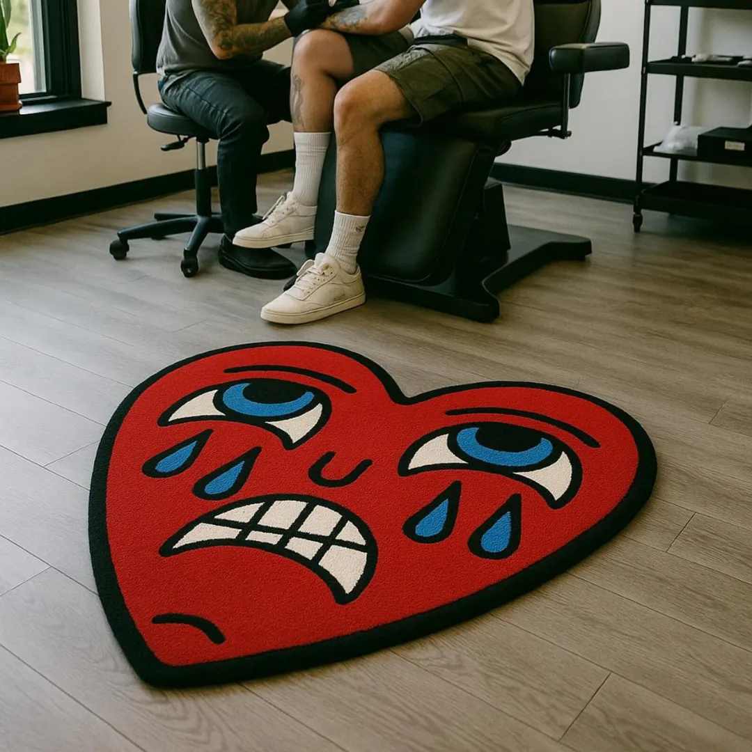 Tattoo-style wool rug featuring a crying heart with expressive eyes and tears