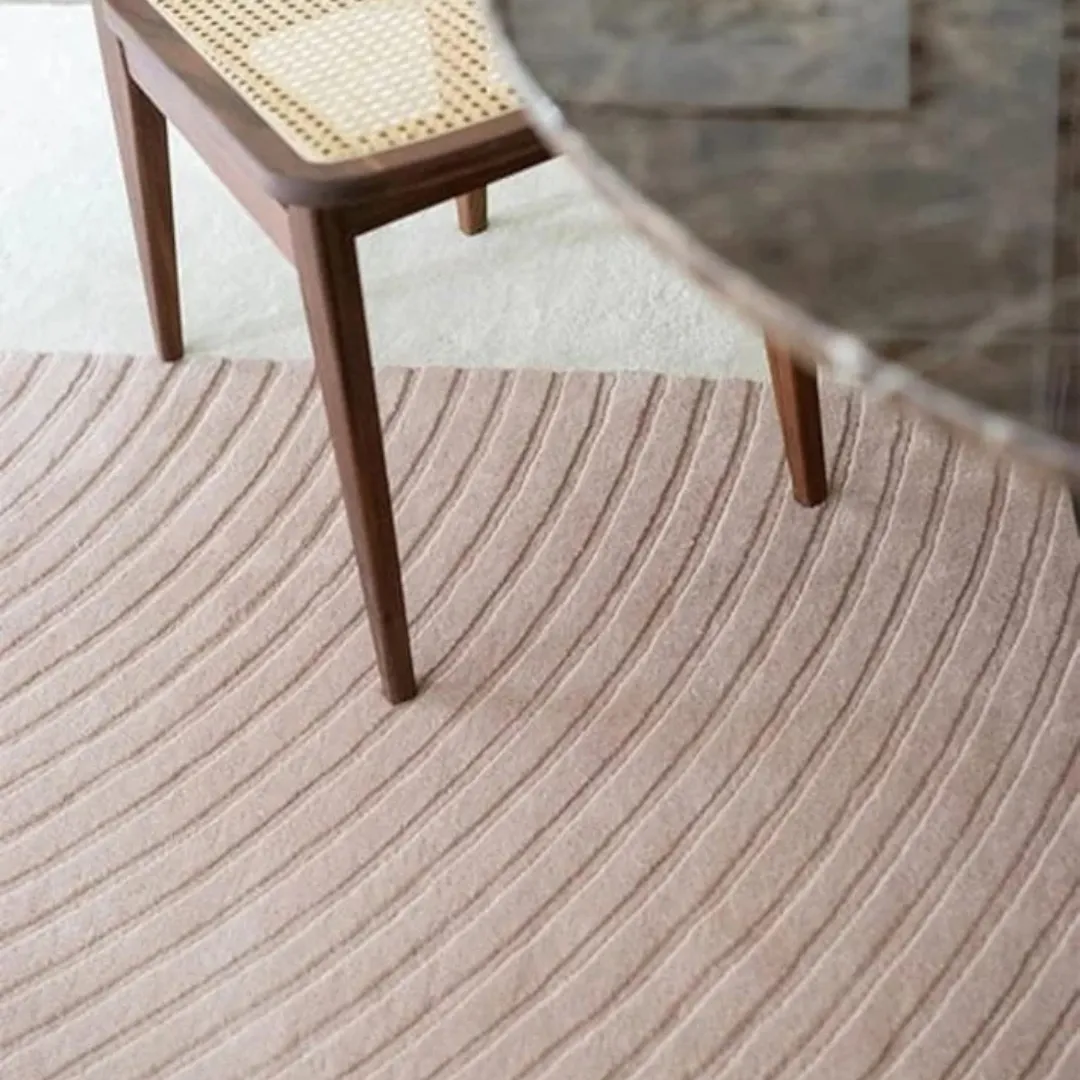 Minimalist area rug featuring soft curves and modern color blocking.