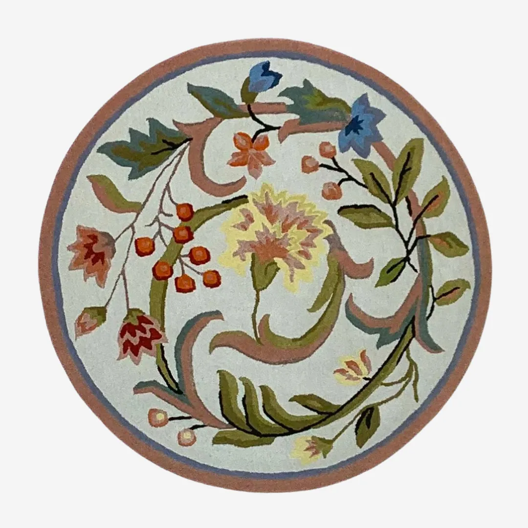 Floral round rug with intricate designs and soft pastel colors