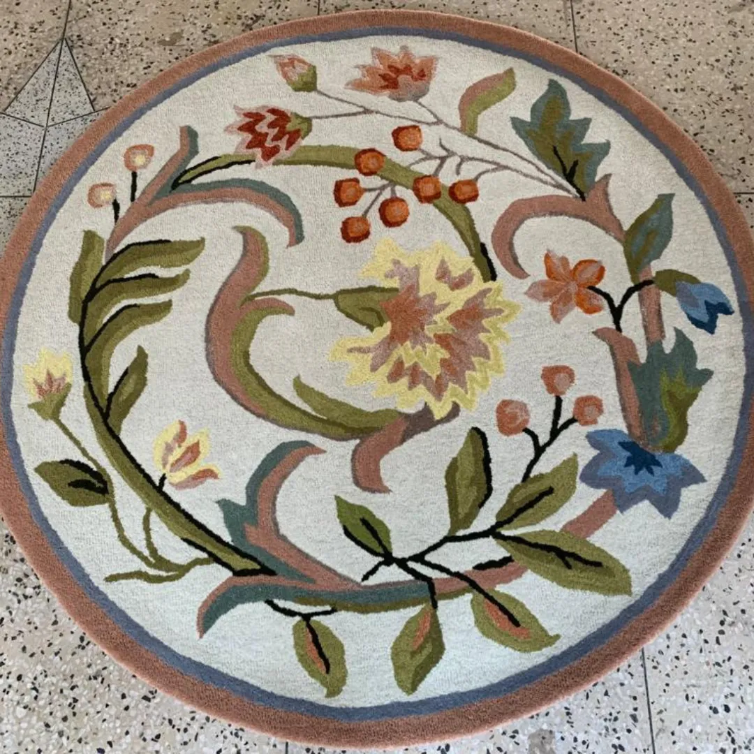 Pastel floral rug featuring colorful flowers, berries, and leaves.