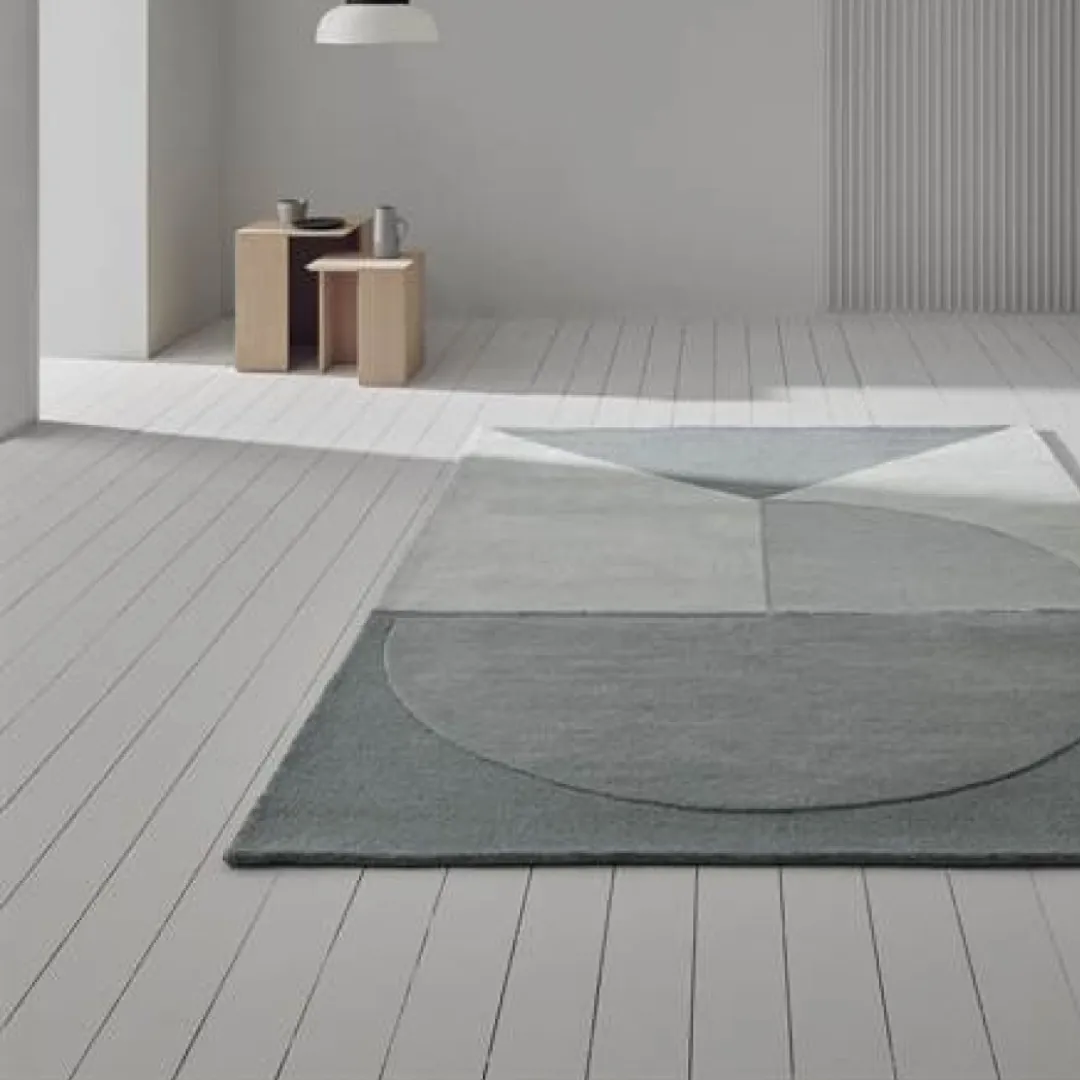 Contemporary gray rug with geometric pattern and soft texture.