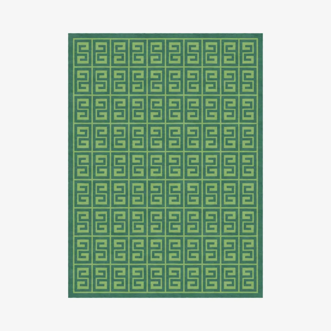 Green Greek key area rug with geometric pattern.