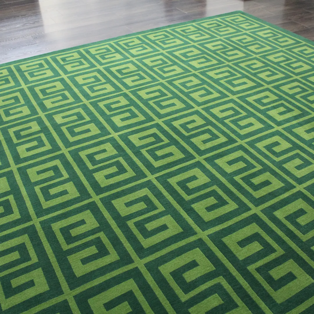 Greek key geometric design rug in vibrant green.