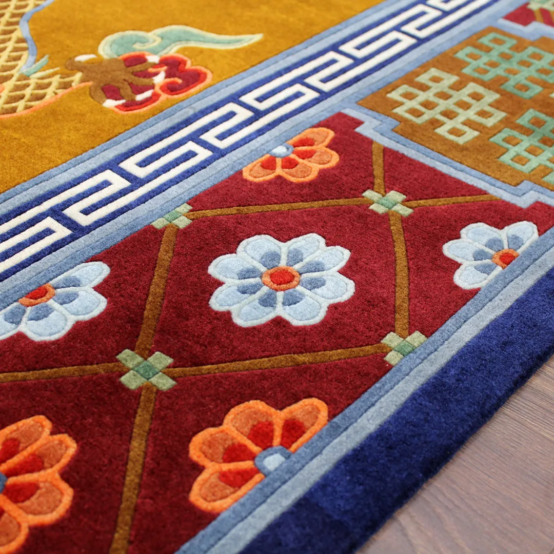 Traditional Chinese rug with dragon and phoenix symbols, surrounded by colorful border accents.