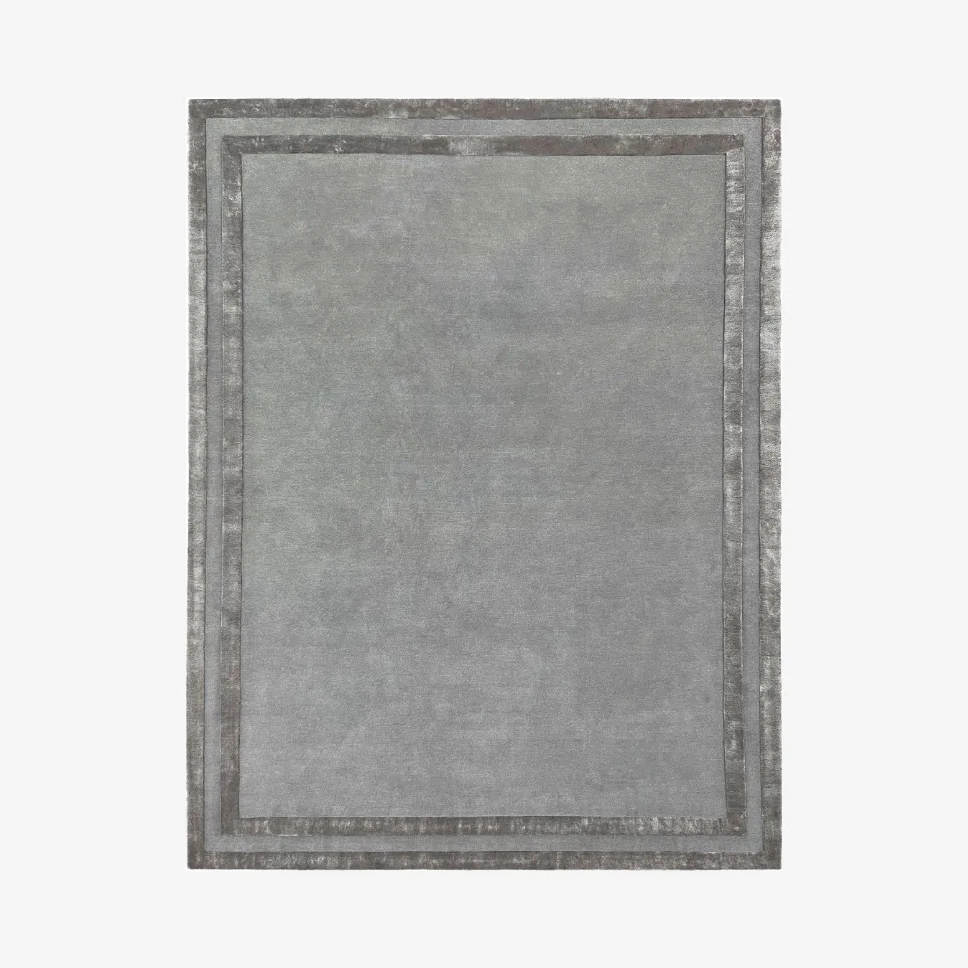 Elegant gray area rug with a refined border.