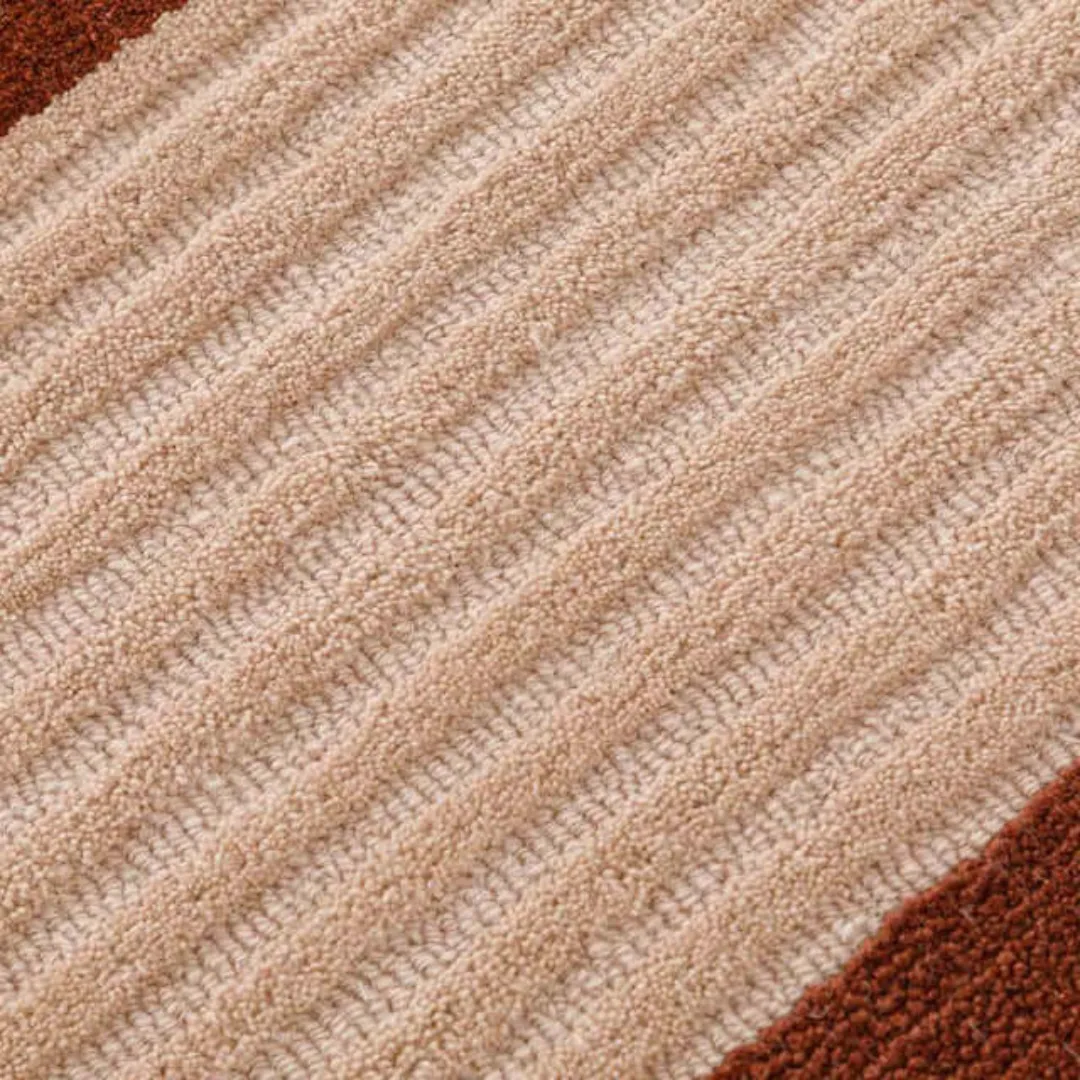 Modern area rug in soft pastel shades with geometric patterns.