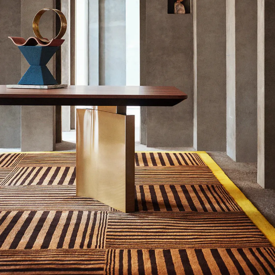 Bold striped grid design rug with brown and yellow colors.