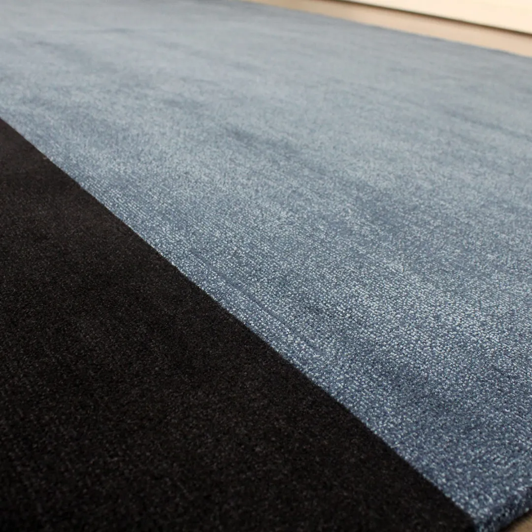 Abstract design rug featuring geometric blocks for contemporary spaces.