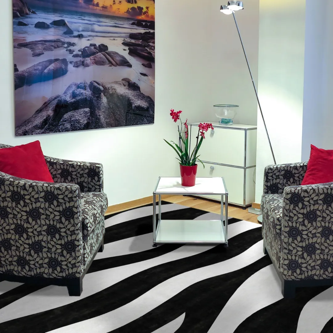 Sleek black and gray waves rug for contemporary decor.