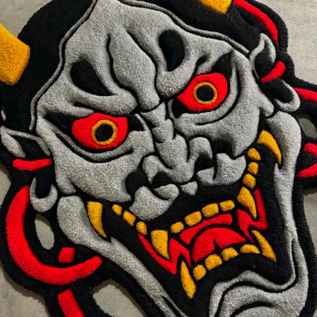 Shadow Oni Inked Rug Japanese-inspired Shadow Oni rug with grey mask, red eyes, and yellow fangs – handmade wool rug