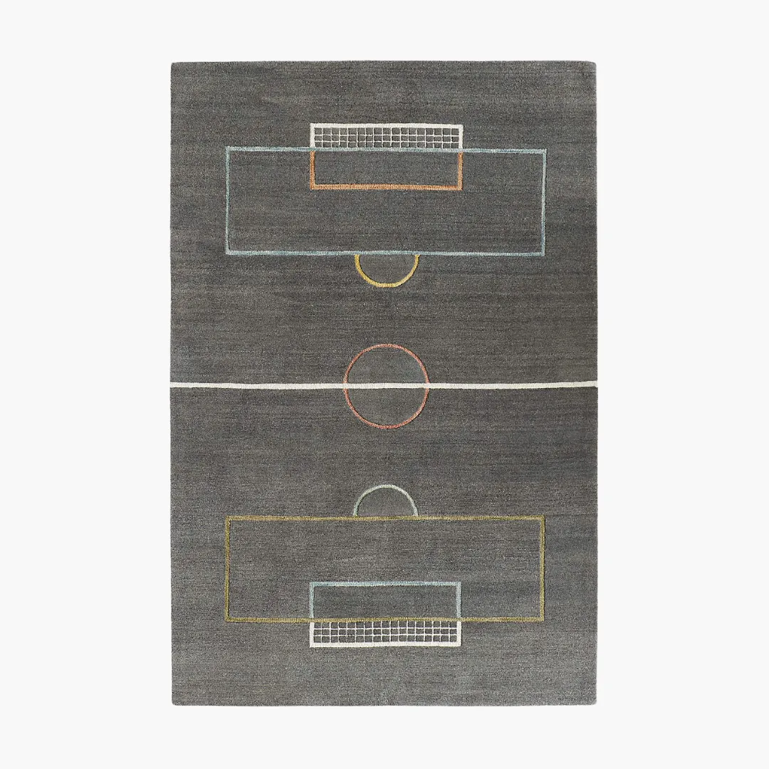 Goal Grid Rug Goal Grid Rug featuring a modern soccer field design on a dark grey base – hand-tufted wool rug by Sneagear