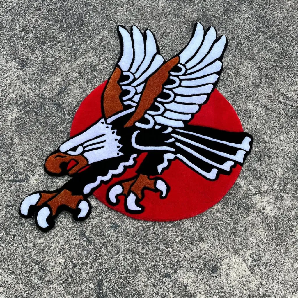 Custom Shape Eagle Rug Red Circle Design Top down view of the Silent Wings Inked rug featuring a traditional tattoo style eagle flying against a red circular background.