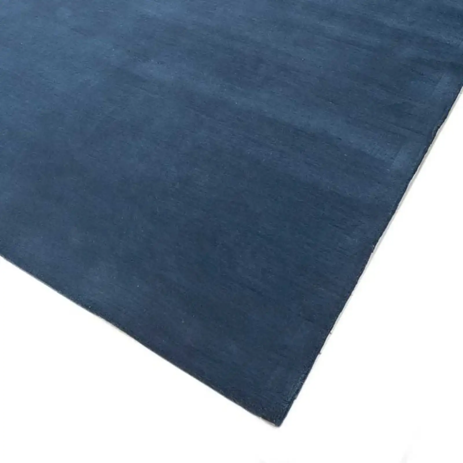 Durable solid blue area rug for high-traffic spaces and contemporary interiors.