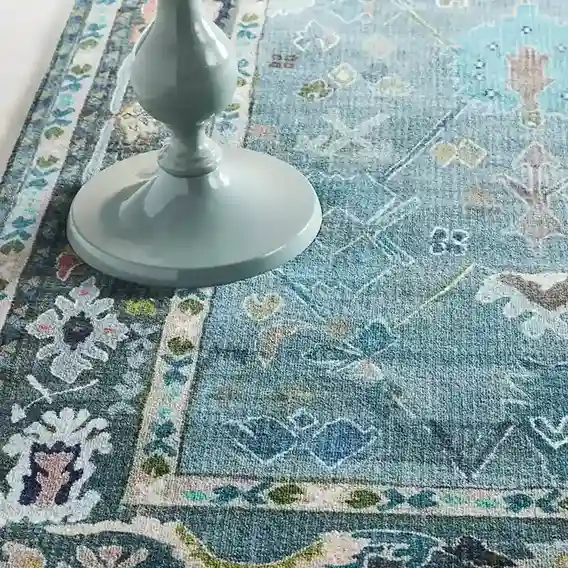 Close-up of distressed design on Vintage Blue Hand-Tufted Rug