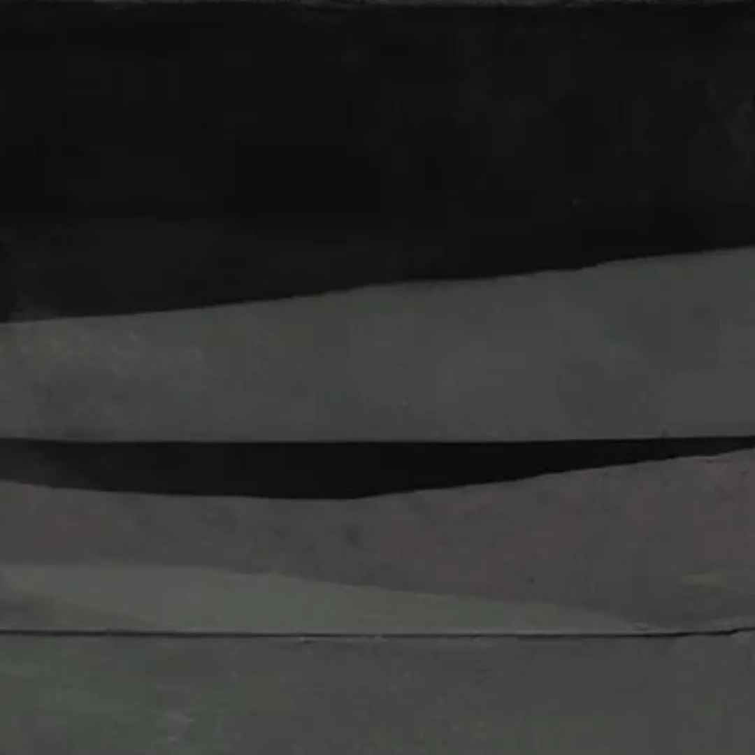 Hand-tufted black pebble-style runner rug with stacked oval design for minimalist interiors and kitchen