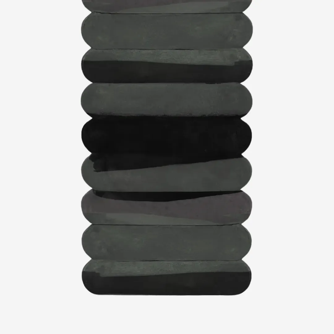 Hand-tufted black pebble-style runner rug with stacked oval design for minimalist interiors and kitchen