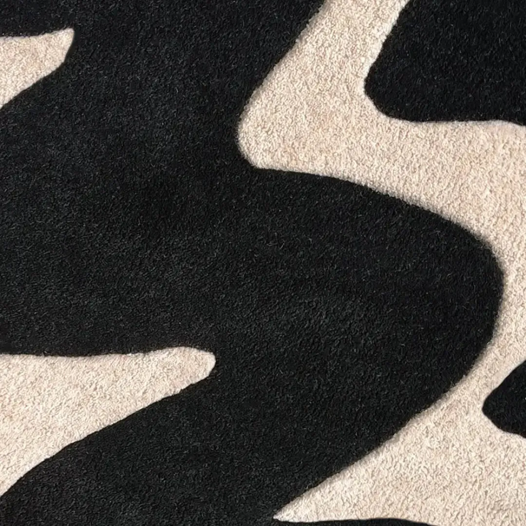 Soft round rug with high-contrast wave design