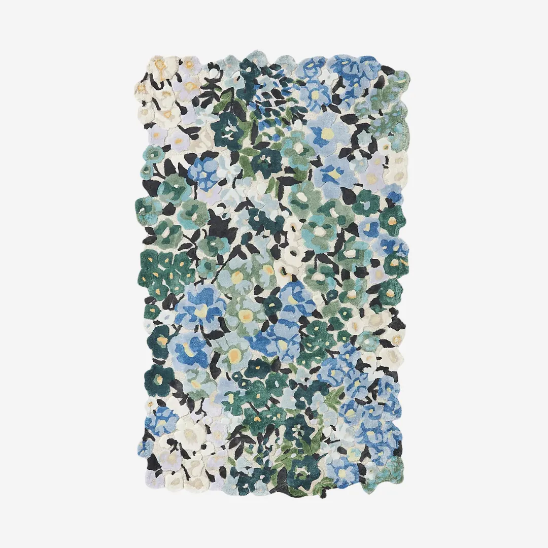 Cassia Floral Area Rug with scalloped edge and blue-green flower design