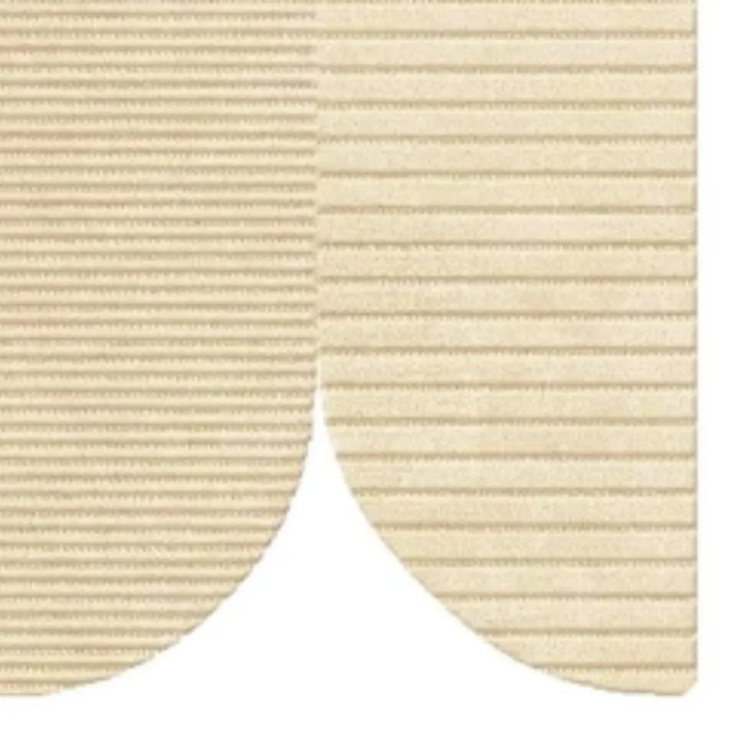 Close-up of raised texture and curved cuts