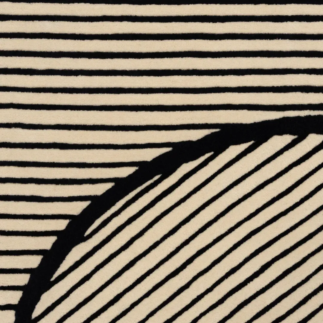 Contemporary rug with bold black outlines and geometric shapes