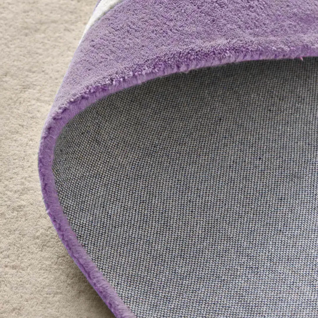 Top view of rectangular rug with purple edge and cream base