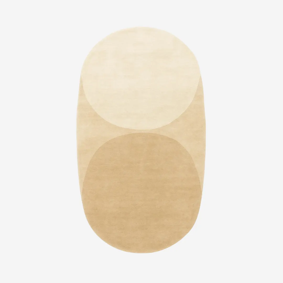 Sandstone Oval Area Rug with layered beige and ivory arches