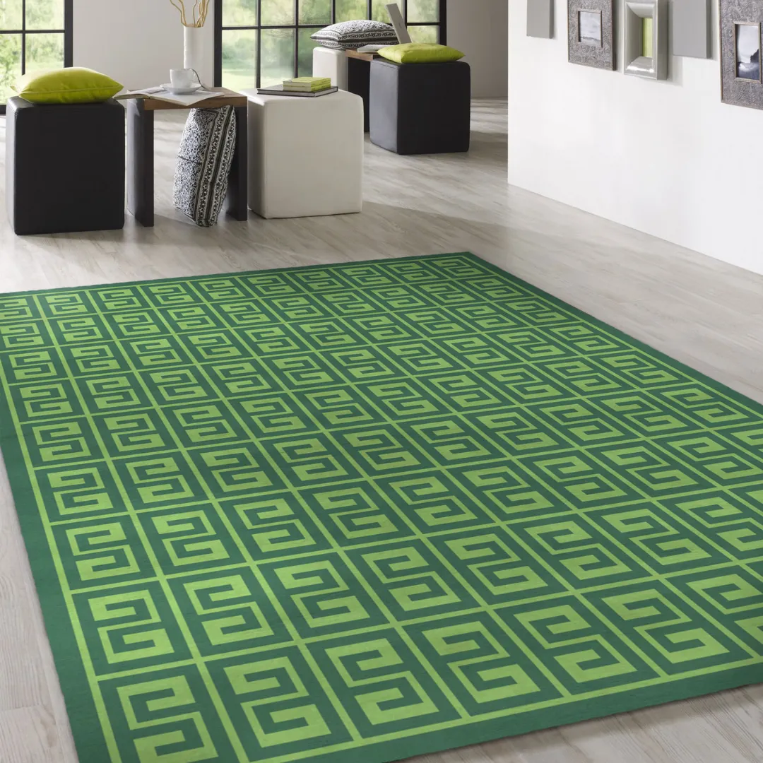 Bold green geometric rug in a modern living room