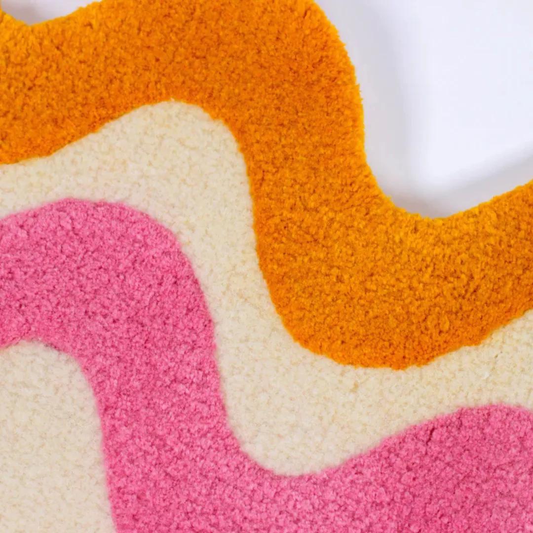 Sculpted rainbow rug laid out in hallway