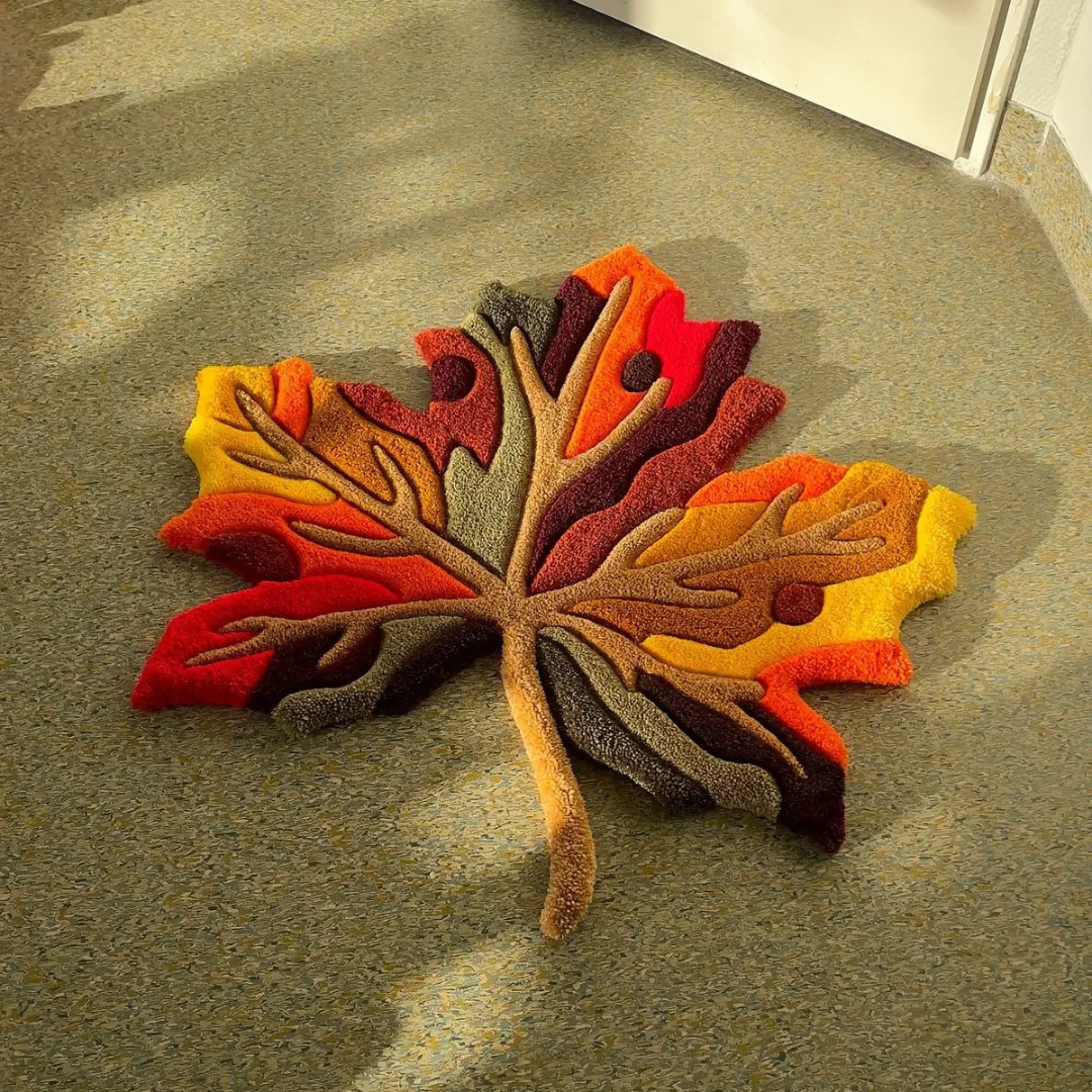 Hand-tufted autumn leaf shaped rug with vibrant colors
