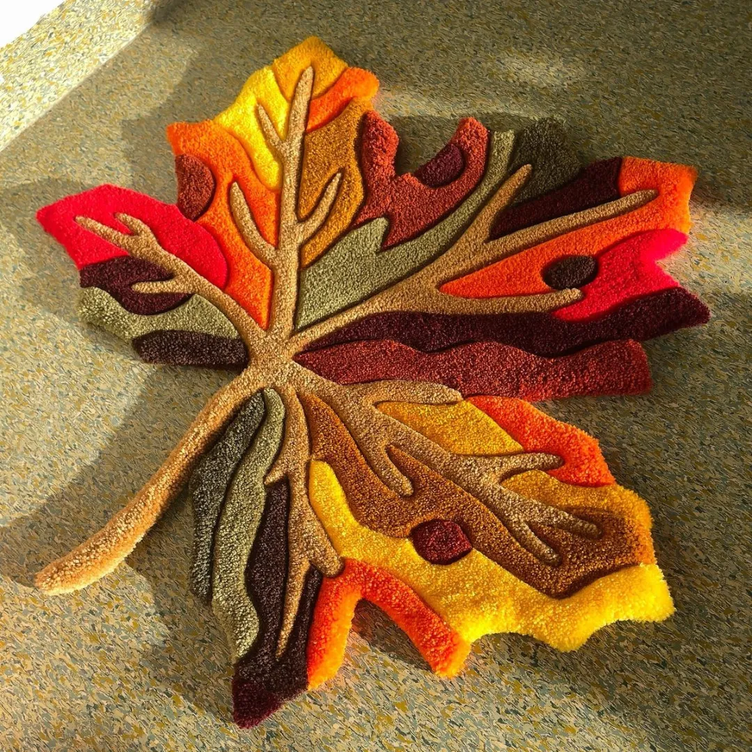 Unique hand-tufted rug in the shape of a colorful autumn leaf
