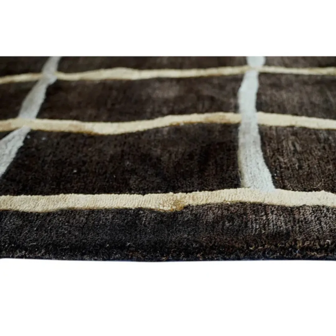 Close-up of wool texture on black and white grid rug