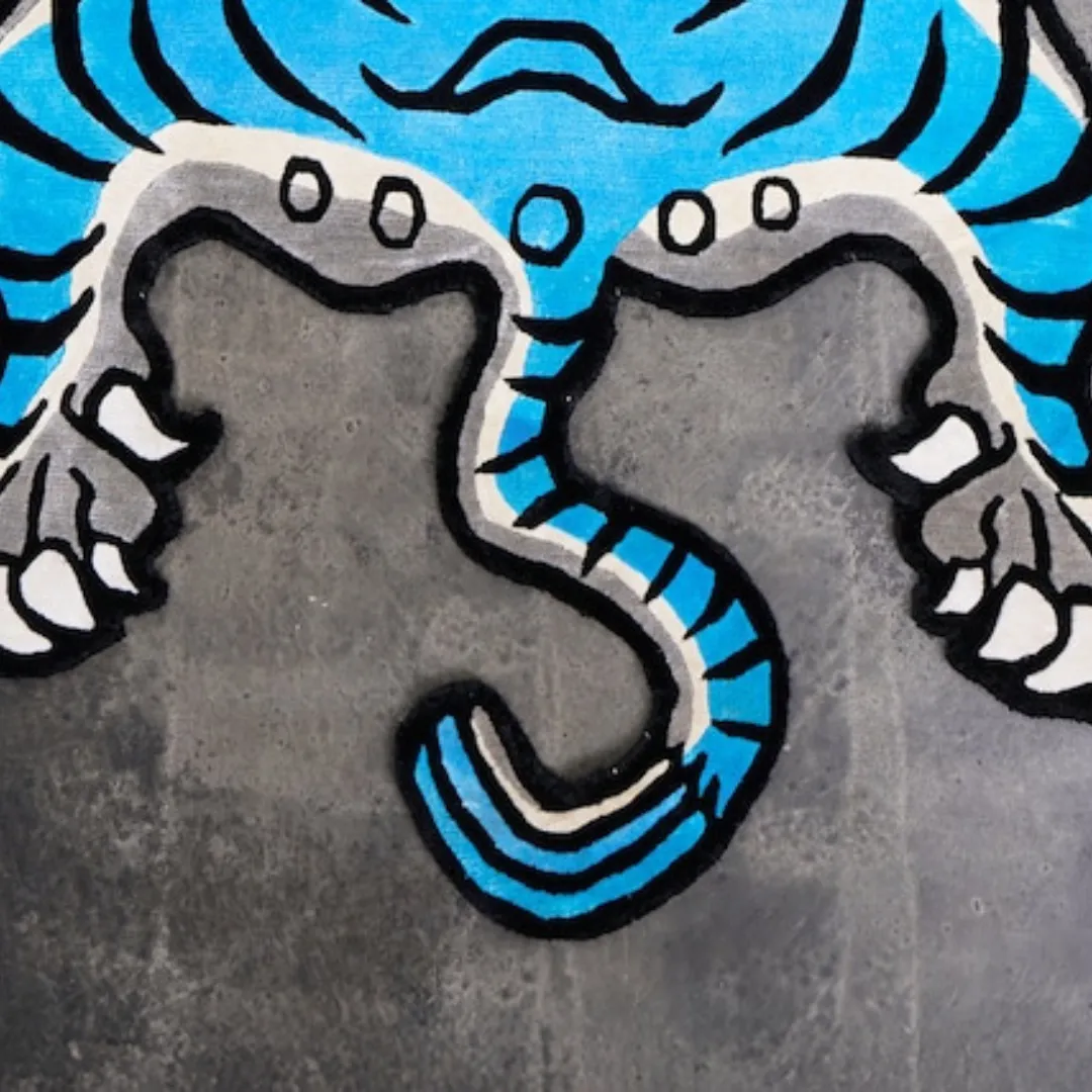 Fierce tiger design in electric blue with bold red accents on the Blue Thunder Rug