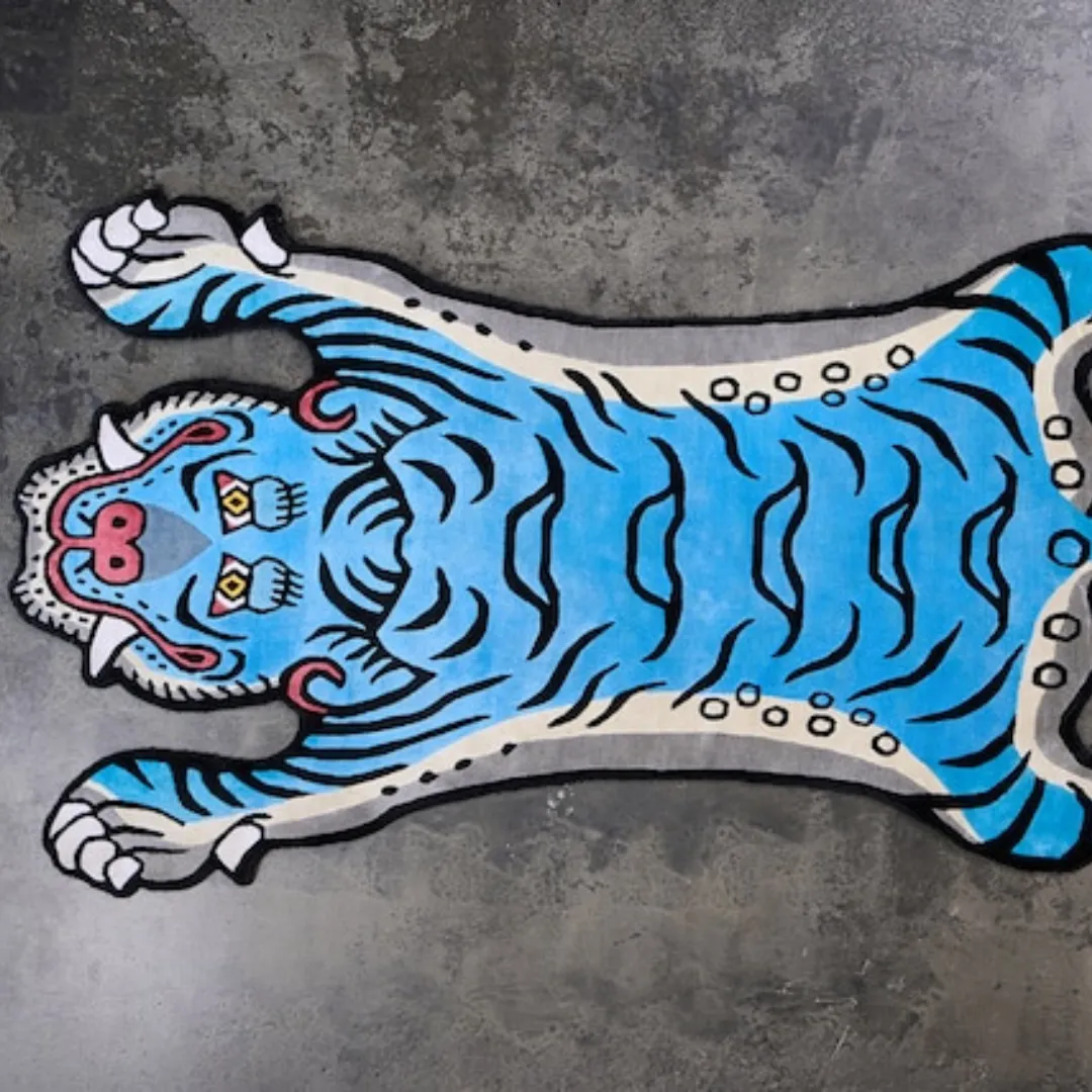 Fierce tiger design in electric blue with bold red accents on the Blue Thunder Wool Rug
