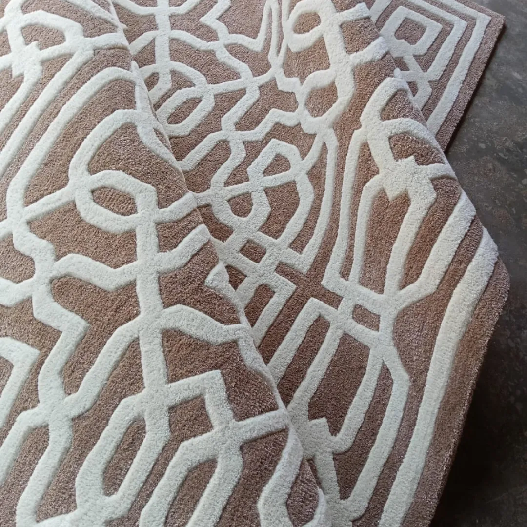 Stylish area rug with an intricate geometric pattern in neutral tones.