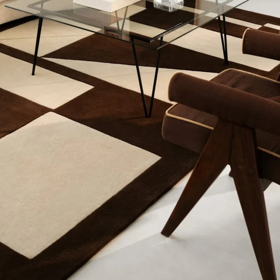 Geometric design rug with beige and brown tones in squares and triangles.