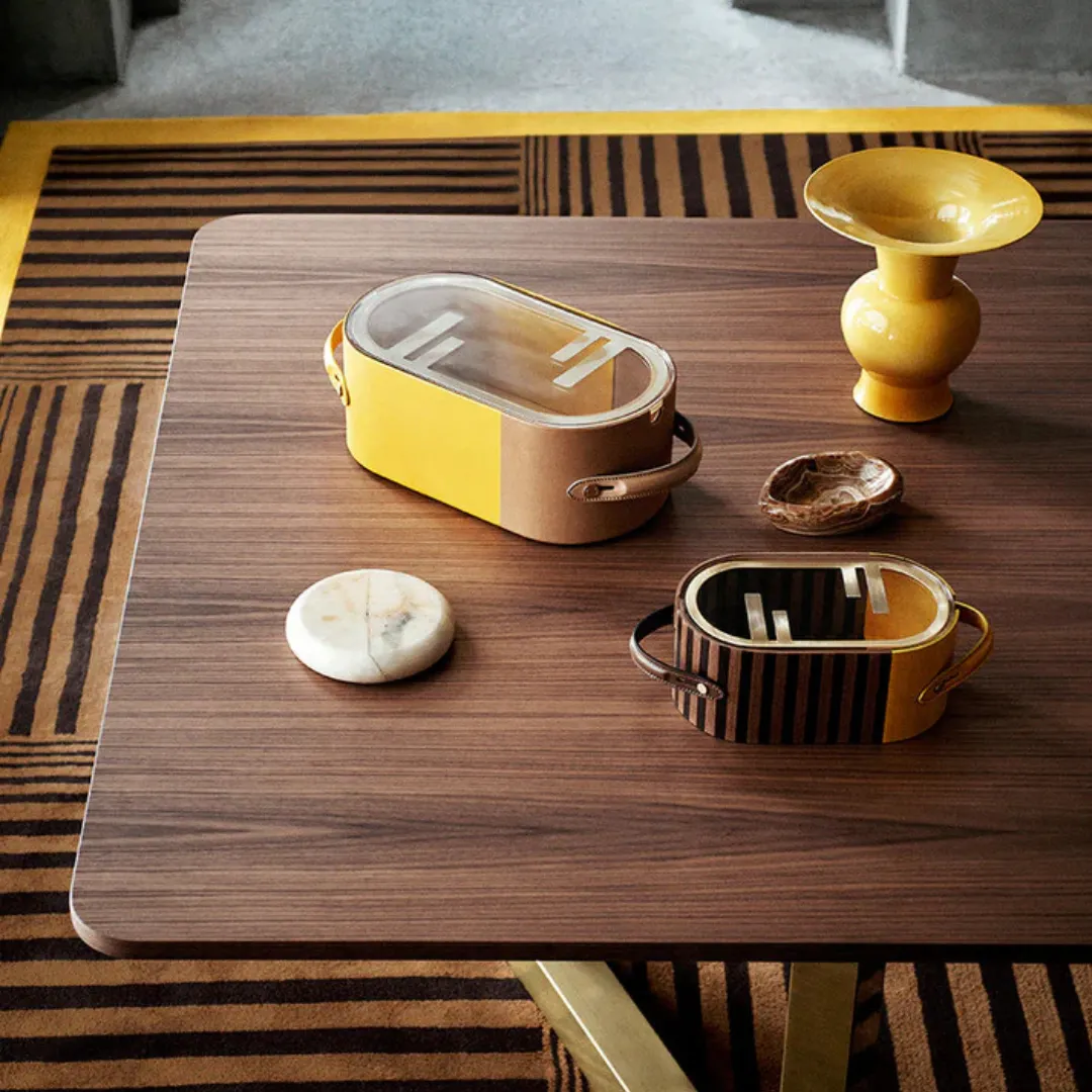 Modern area rug featuring a yellow and brown striped pattern.