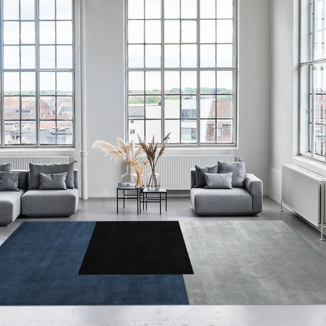 Soft and durable rug with bold color blocks in a minimalist style.