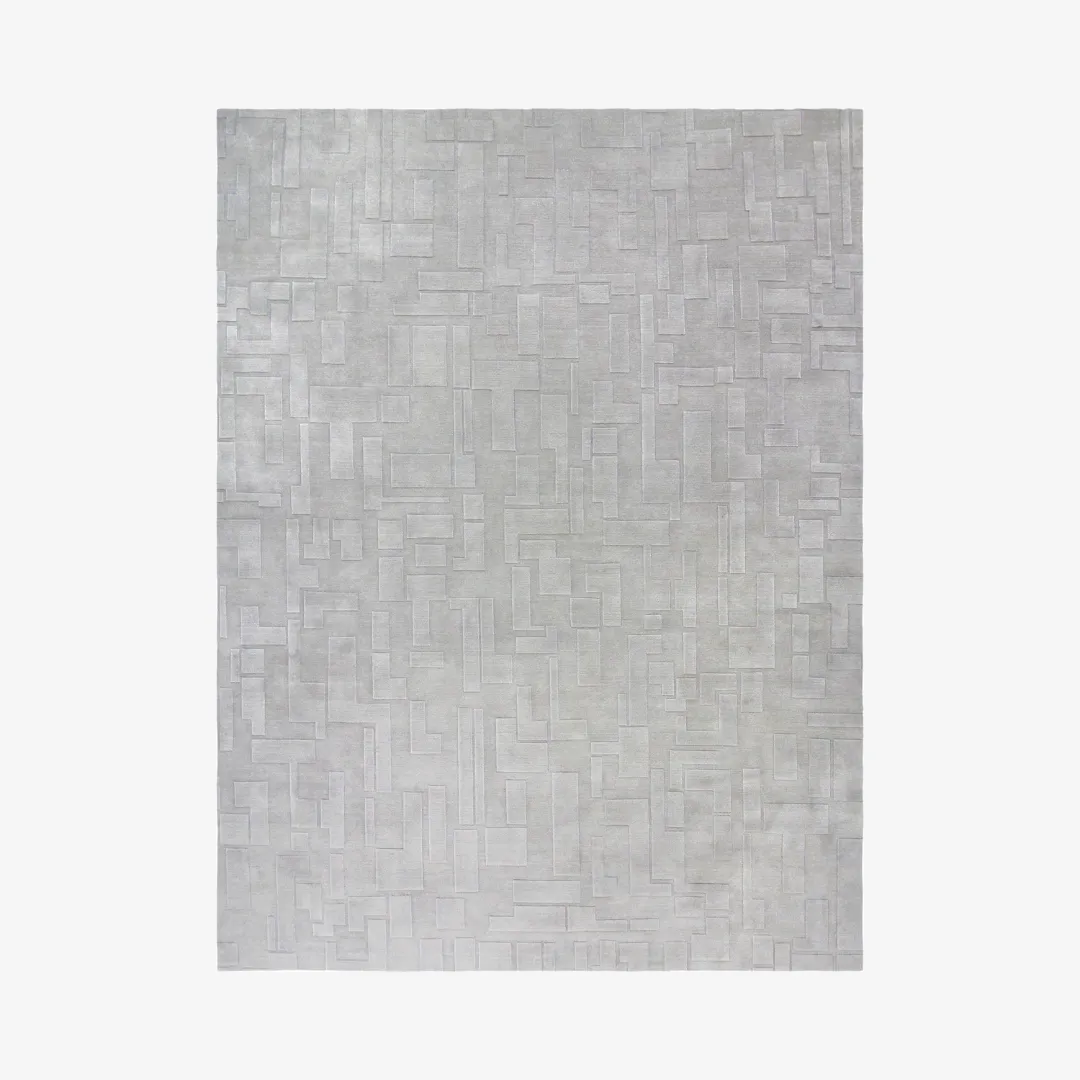 Urban maze gray area rug with a geometric pattern.