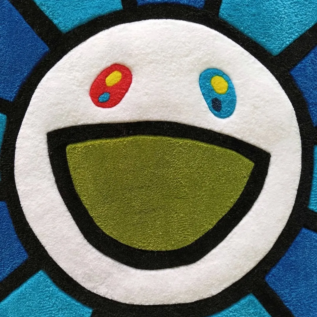 Blueberry Rug Handmade Blueberry Mirage Rug crafted from soft wool with deep blue tones and artistic flower-inspired design.