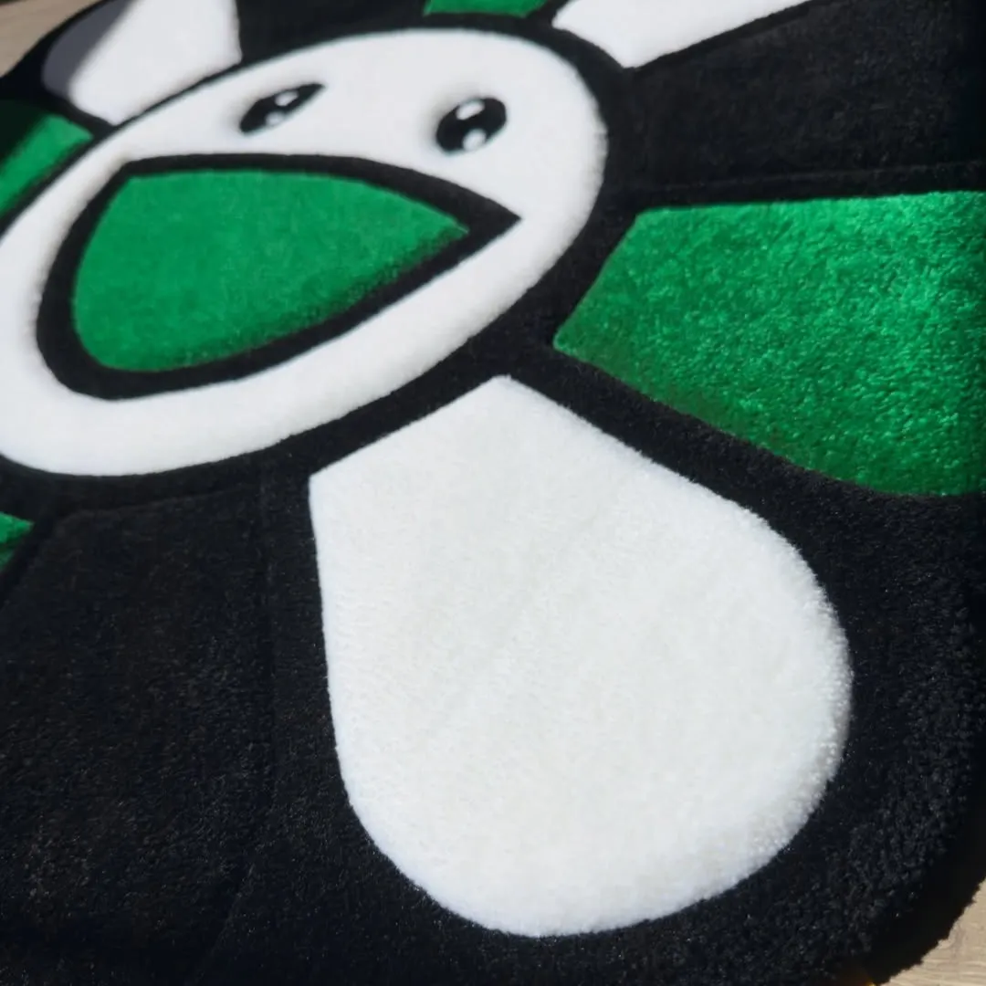 Emerald Rug Handmade Emerald Bloom Rug with a floral shape and cheerful smiley motif, perfect for adding color and playfulness to home decor.