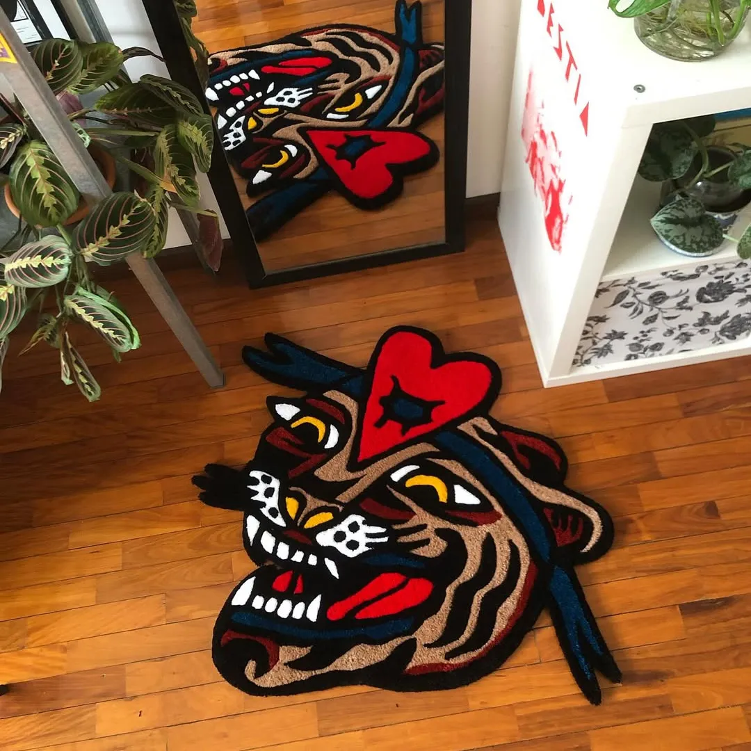 Heartbreak Beast Inked Rug Vibrant Heartbreak Beast Rug with artistic tiger head design in red, brown, and blue tones