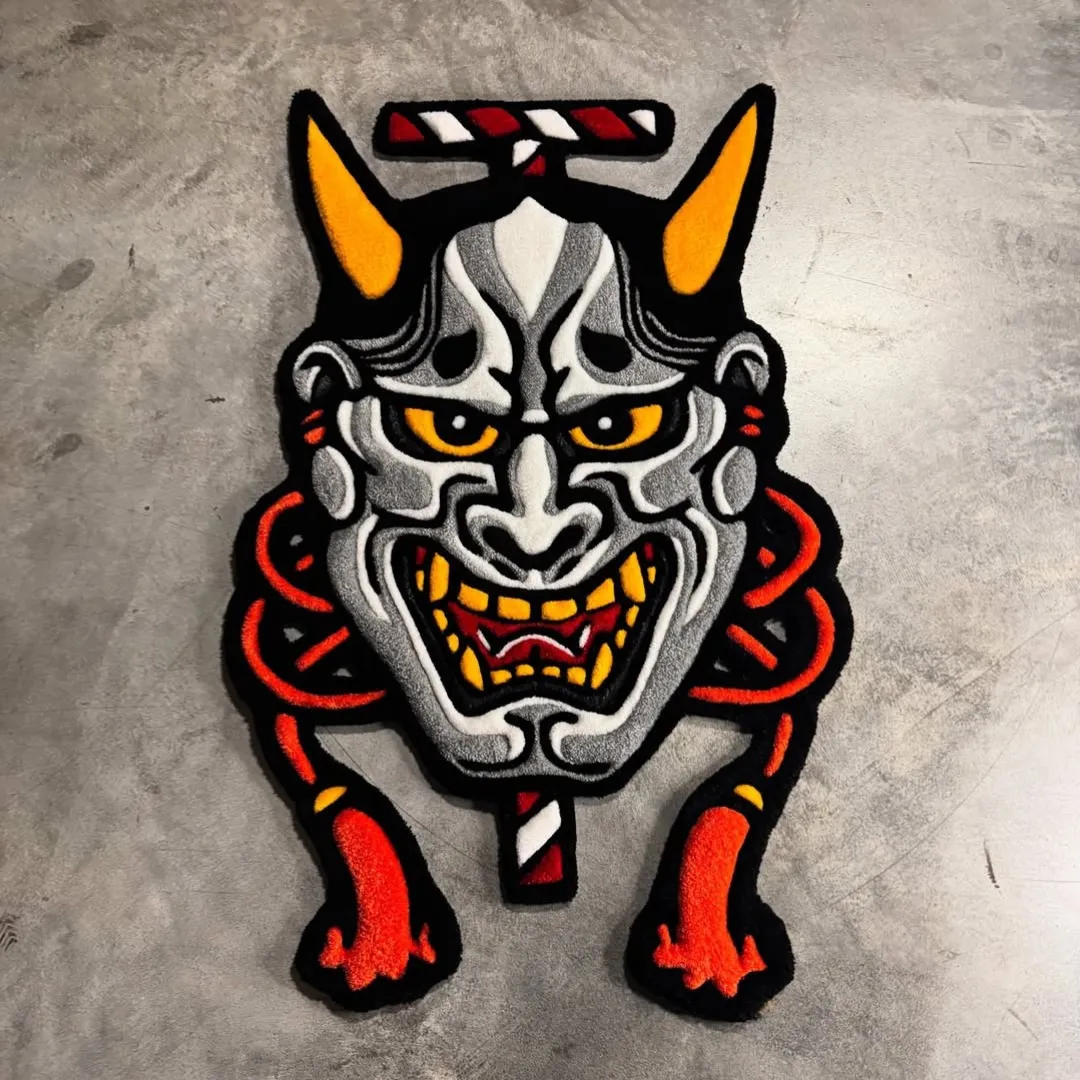 Inferno Oni Rug Inferno Oni Rug featuring fiery red rope detailing and yellow horned demon mask design – hand-tufted rug