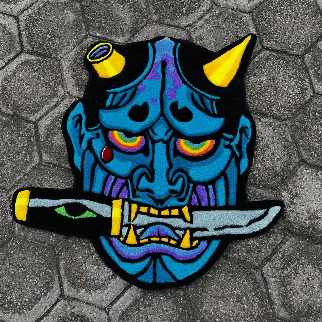 Oni Rug Hand-tufted Japanese Oni mask rug with colorful detailing and sword bite design by Sneagear
